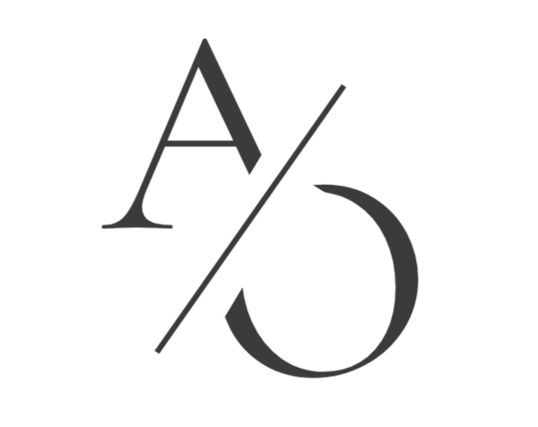 Black and white logo with stylized letters 'A' and 'D' on a white background